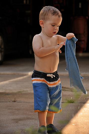 Jackson washing the car